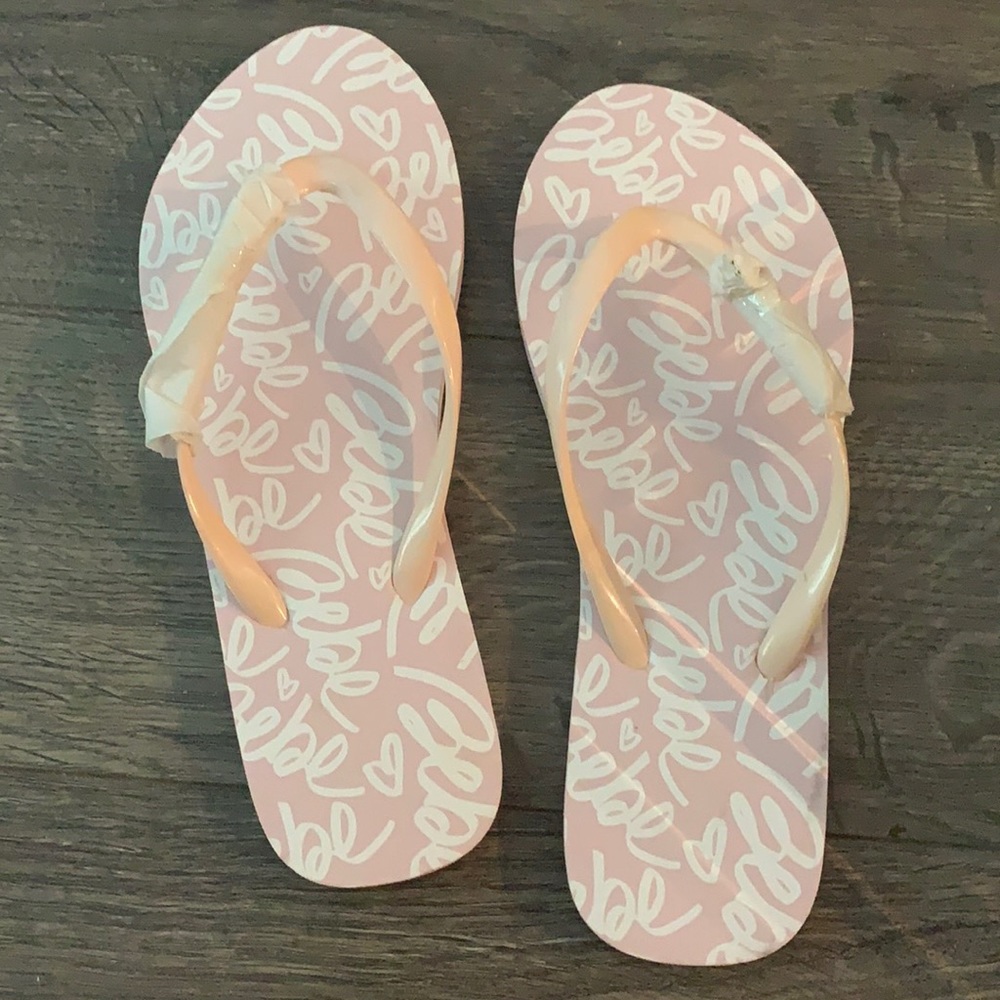 Bebe Light pink logo flip flops